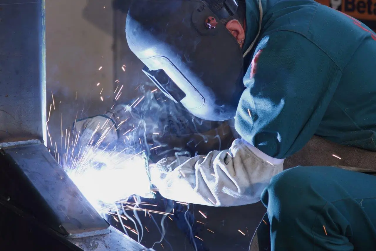 Welder in mask